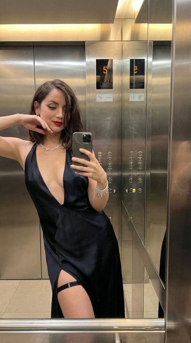 Luxury Elevator Mirror Selfie in Deep V-Neck Dress — example 1