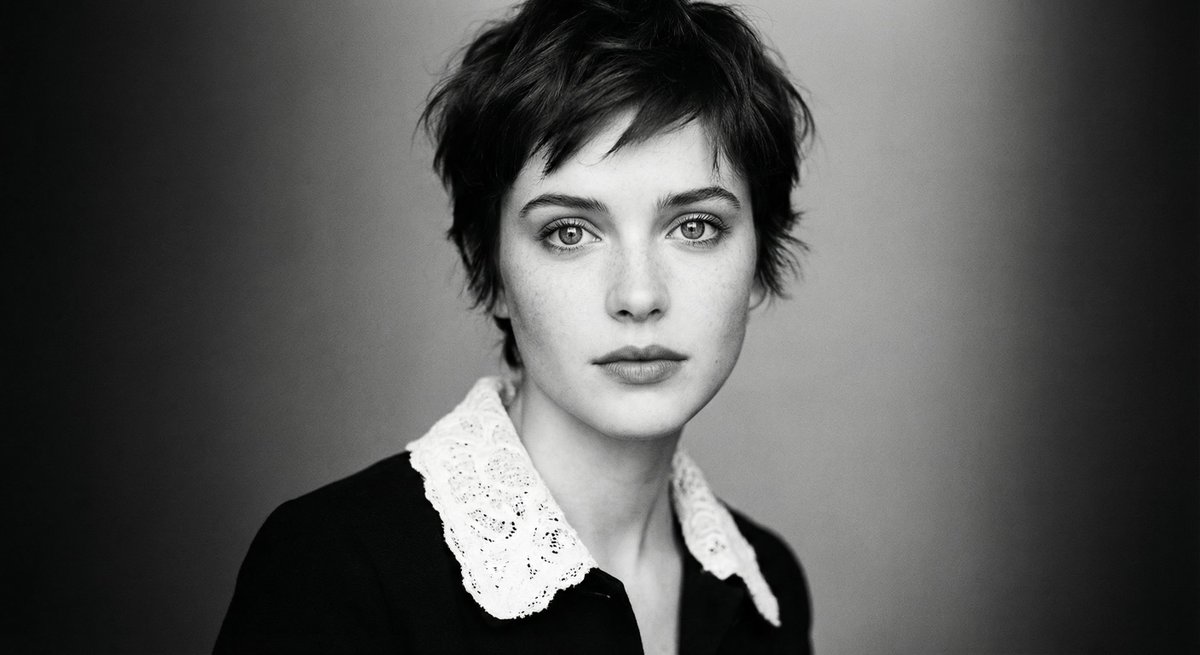 Monochrome cinematic portrait of young woman — example 1