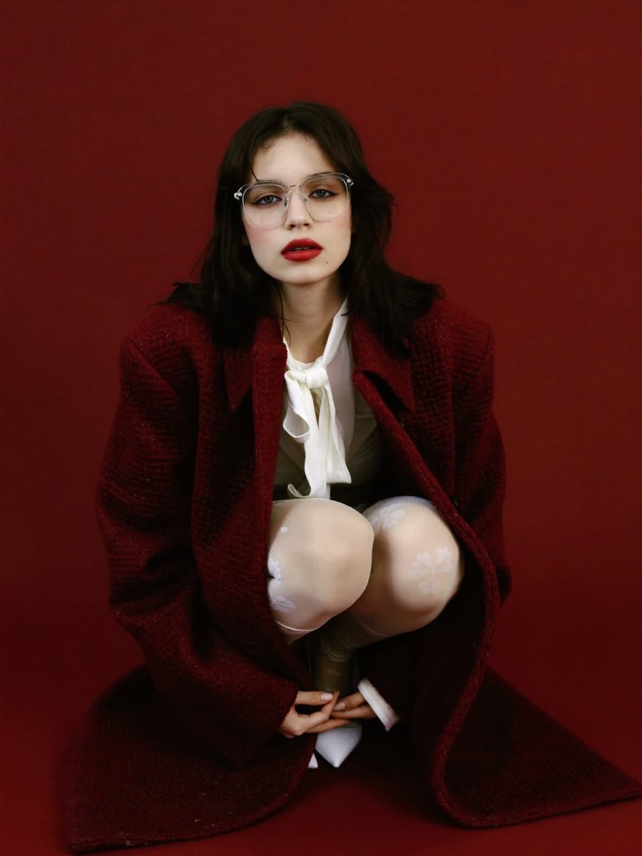 High-Fashion Editorial Portrait with Red Background — example 1