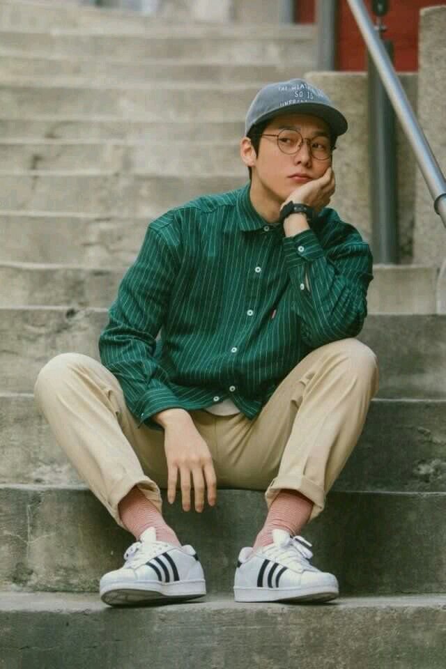 Introspective Young Man on Concrete Stairs — example 1