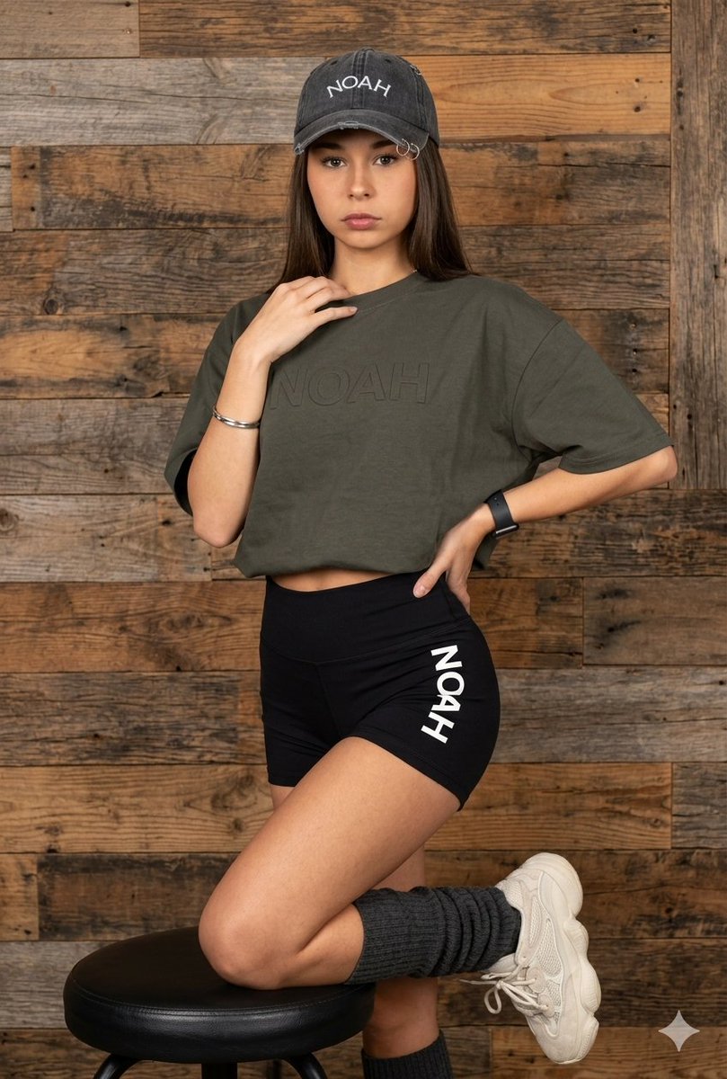 Latina Model in Distressed Denim and Wood Background — example 1