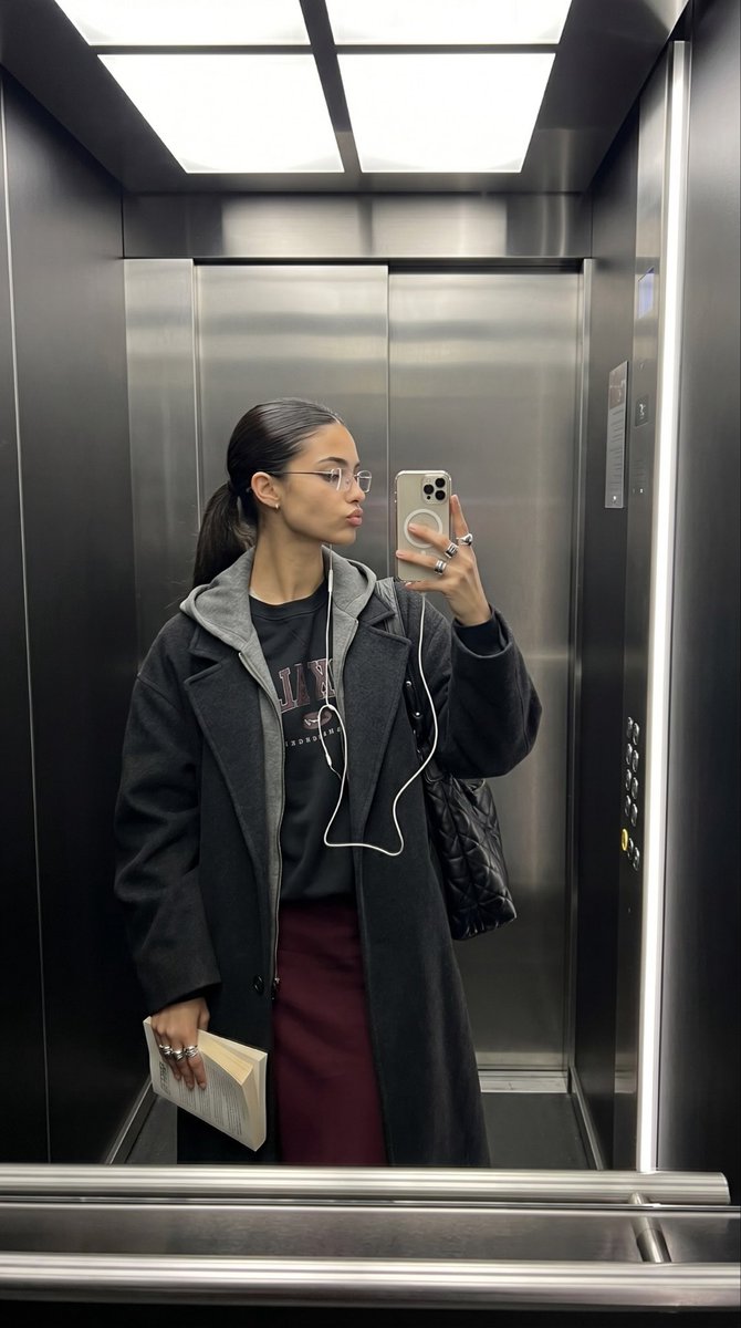 Elevator Mirror Selfie with Book — example 1
