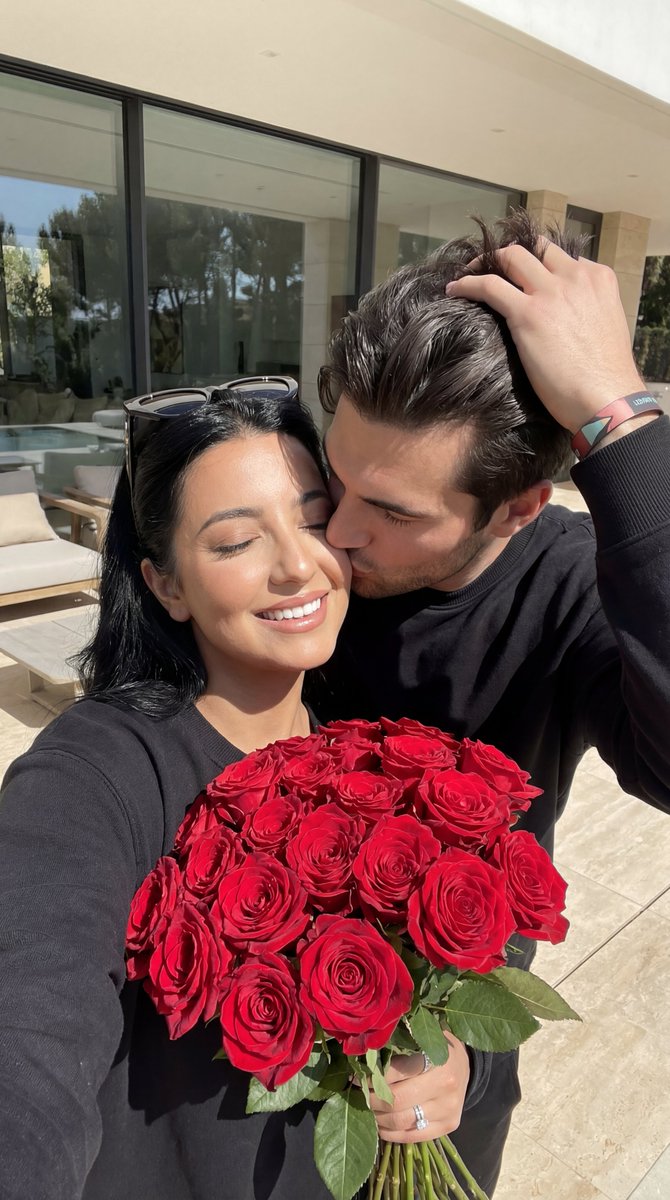 Photorealistic Couple Portrait with Harsh Midday Sun and Red Roses — example 1