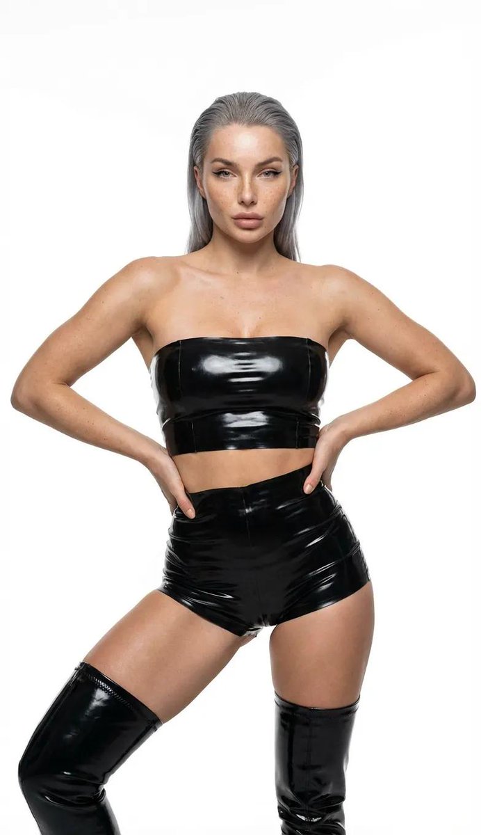 Ultra-realistic high-fashion studio photography of a woman in black latex — example 2