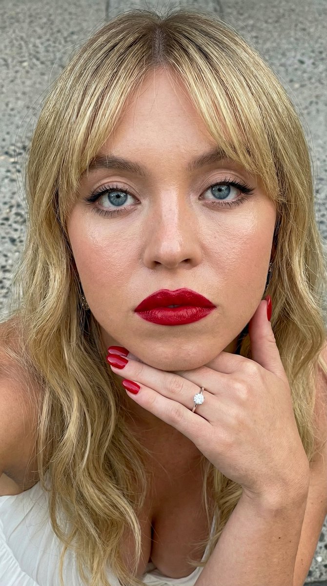 Close-up Portrait Prompt with Downward Gaze — example 1