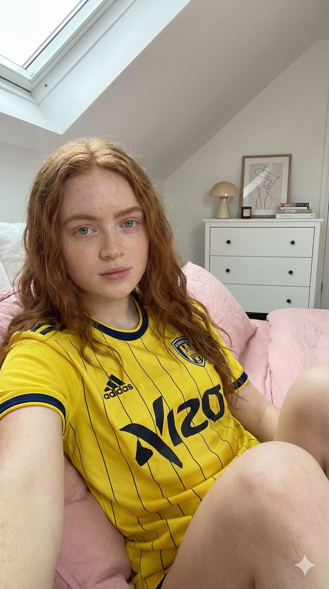 Photorealistic Selfie of Sadie Sink in a Soccer Jersey — example 1