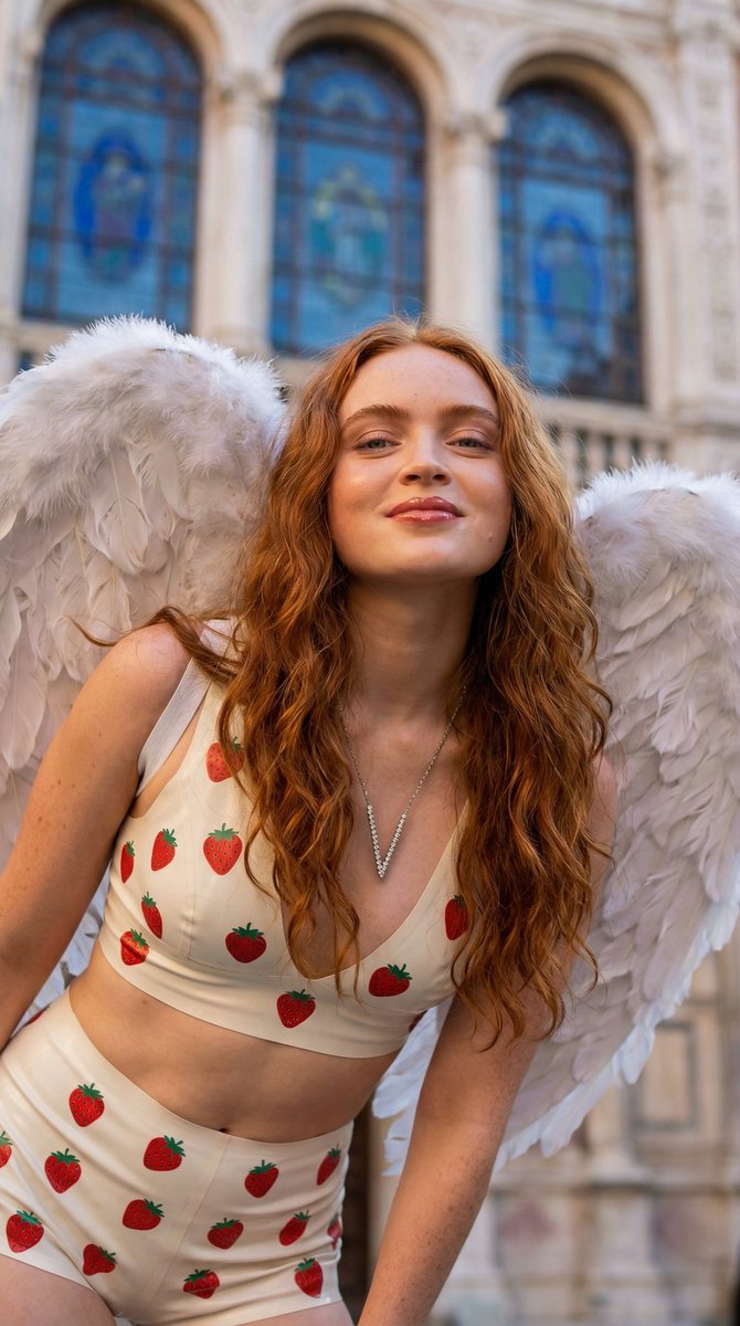 Low-Angle Portrait of Woman with Angel Wings and Cherry Pajamas — example 1