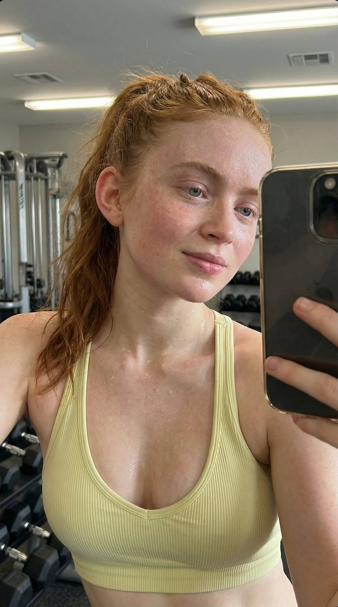 Photorealistic Post-Workout Sadie Sink Selfie — example 1
