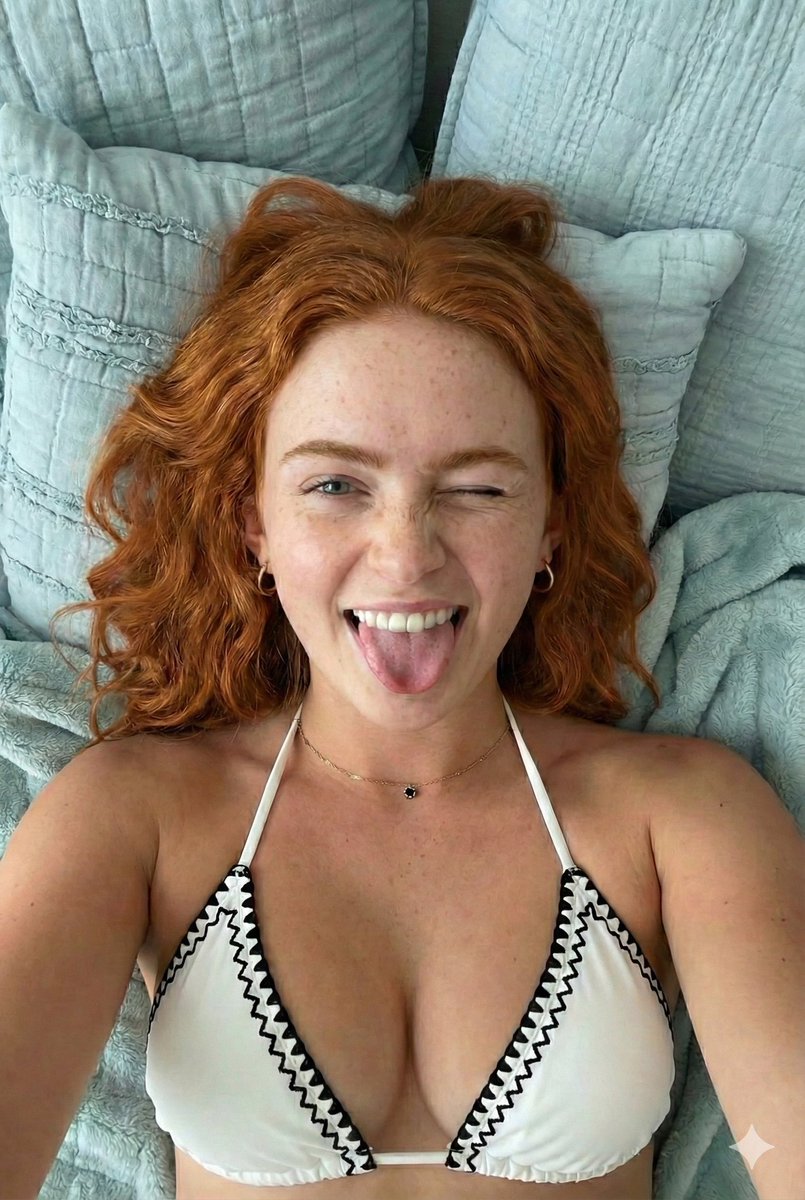 Close-up Portrait of a Playful Young Woman Lying Down — example 3