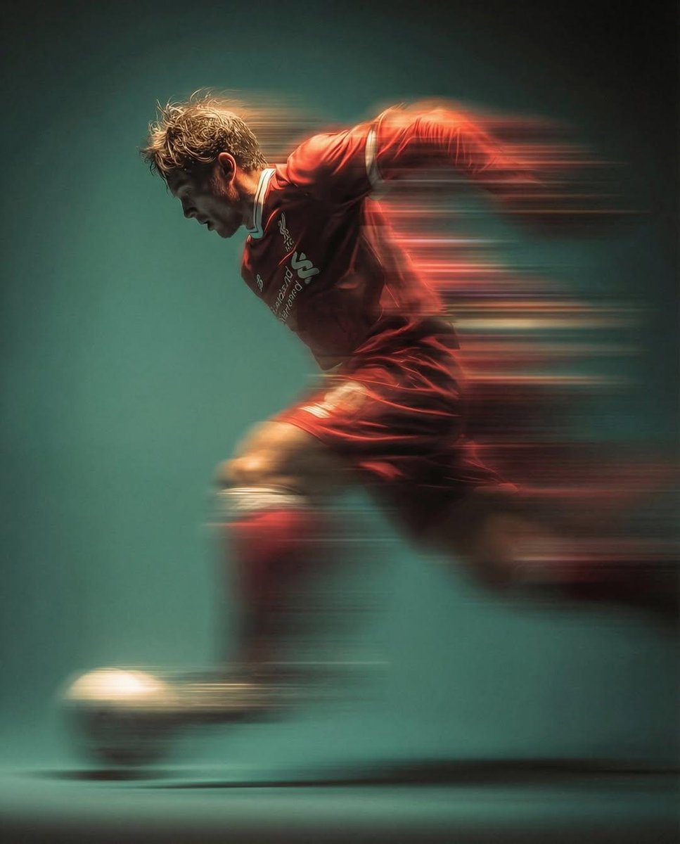 Panning shot of a soccer player kicking a ball — example 1