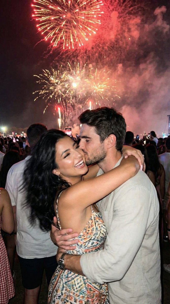 Candid Smartphone Snapshot of Festival Kiss with Fireworks — example 1