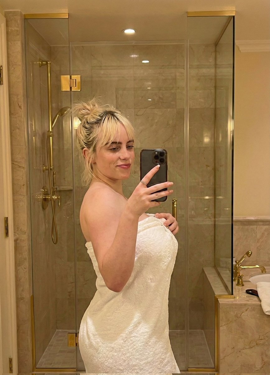 Sabrina Carpenter Mirror Selfie in a Luxurious Marble Bathroom — example 2